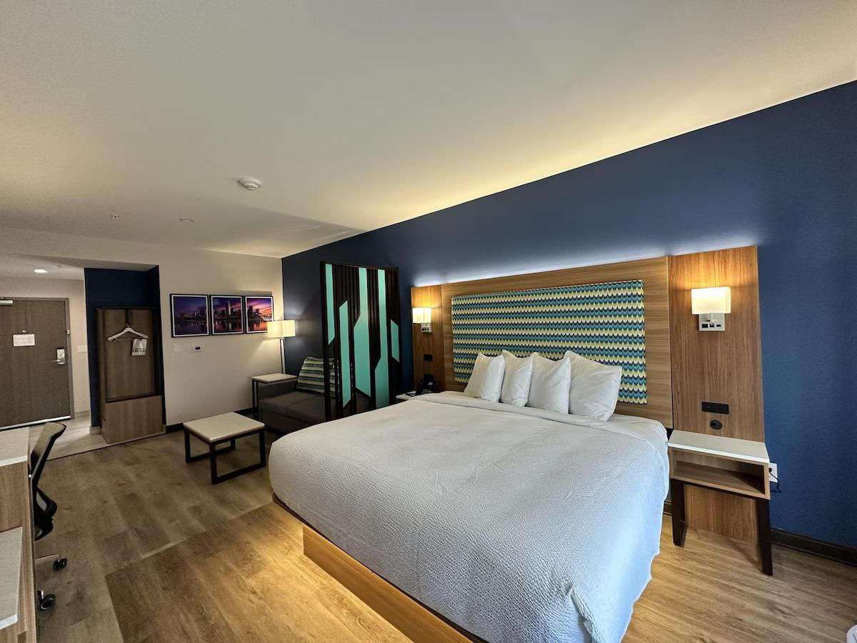 Guest room with backlit headboard